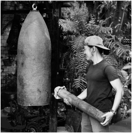 Unexploded US munition used as a gong.