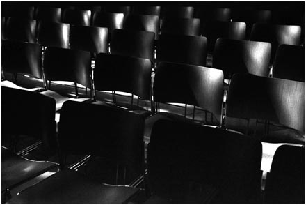 Chairs at Canterbury cathedral, bathed in light from windows